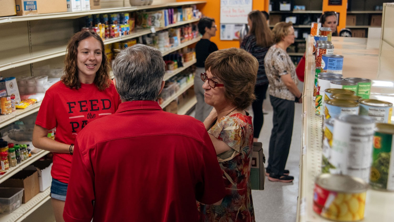 Students and staff gather for the grand-opening of the new Pack Essentials Hub.