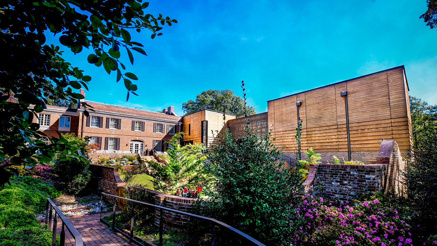 The Gregg Museum of Art & Design surrounded by vibrant spring florals.